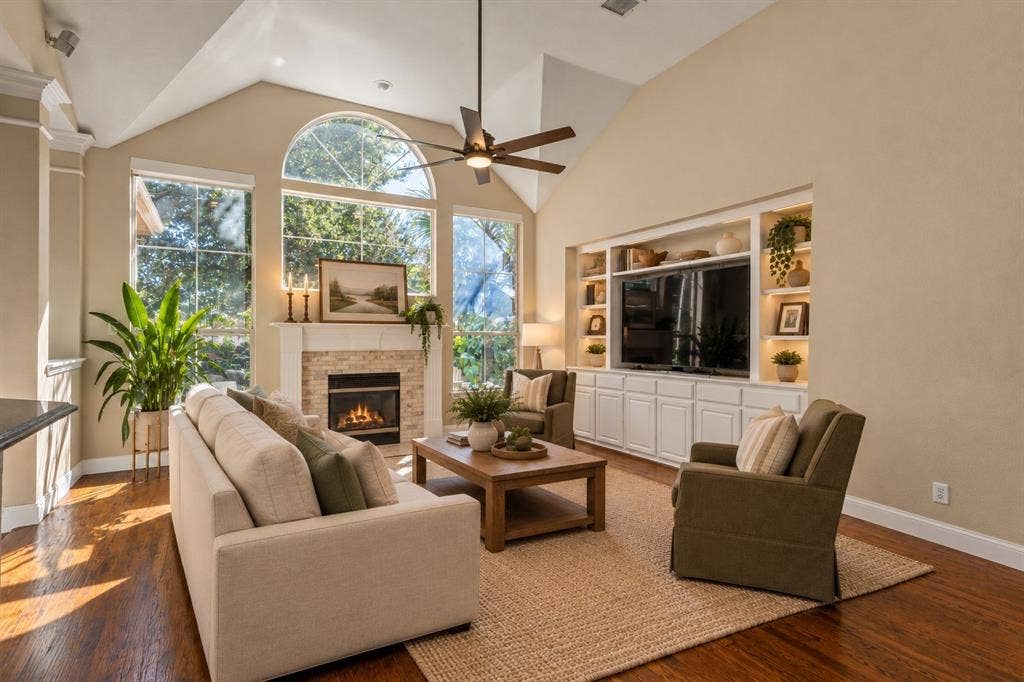 5705 Sandalwood Drive, McKinney, TX 75072 Virtually staged living room with a clean, bright, and inviting design that highlights the space’s open and comfortable feel.