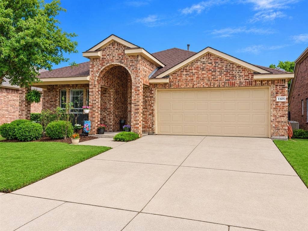 2 car garage and driveway with ample parking space.