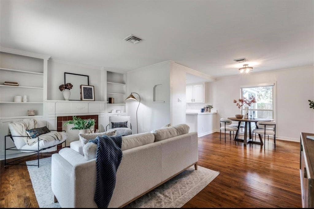1323 Engle Avenue, Dallas, TX 75224 Warm wood-finish flooring extends through this open living space