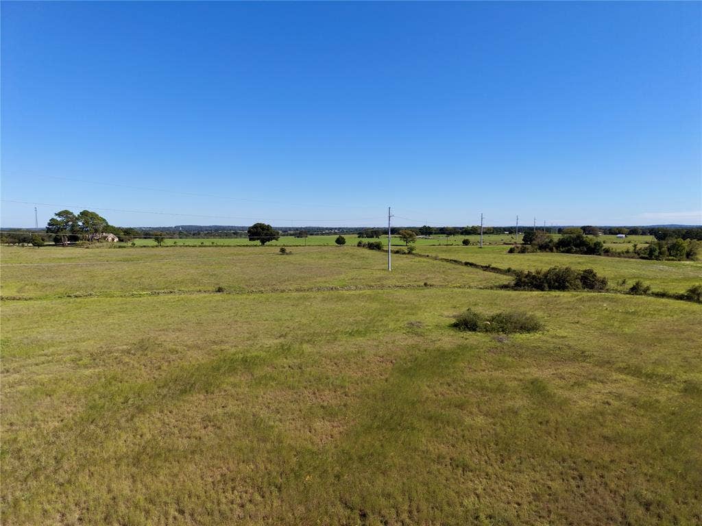 0 Goodell Lane, Eustace, TX 75124 Elevated view of open ground, scattered trees and the transmission corridor.