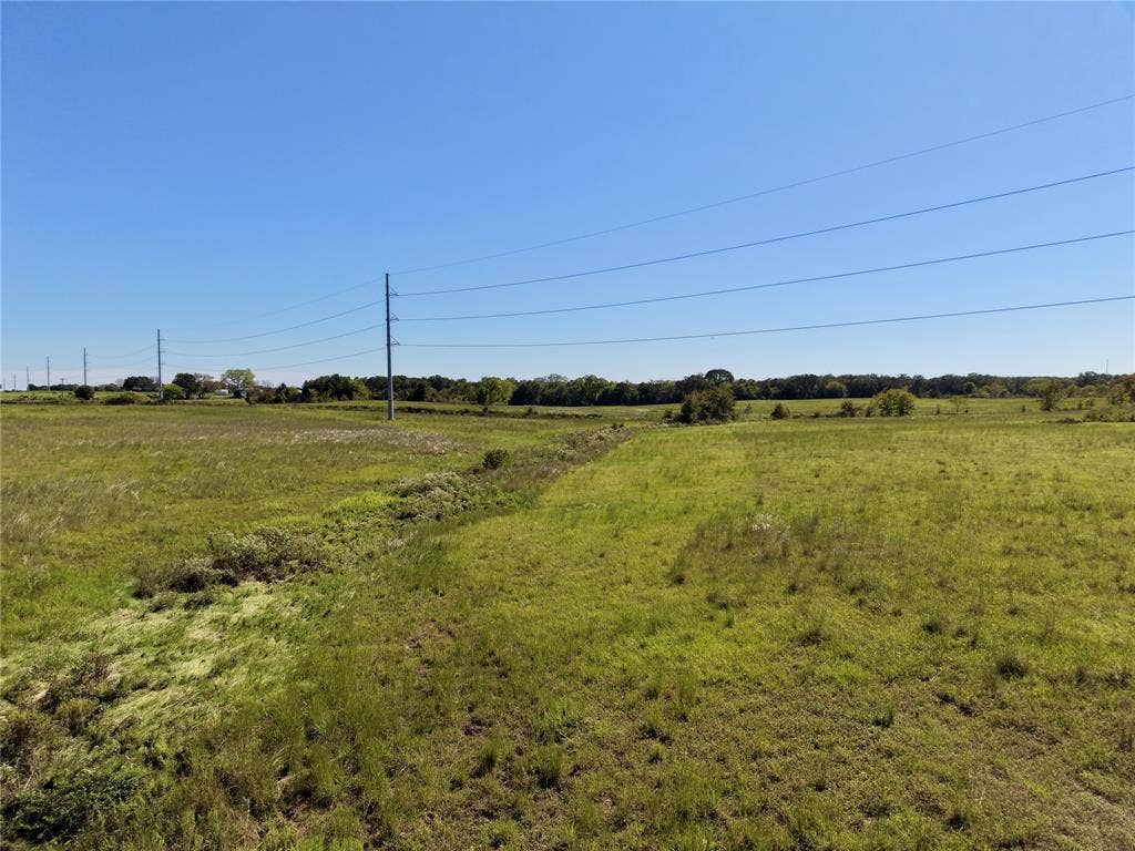 0 Goodell Lane, Eustace, TX 75124 View of the drainage swale and overhead transmission lines crossing the tract.