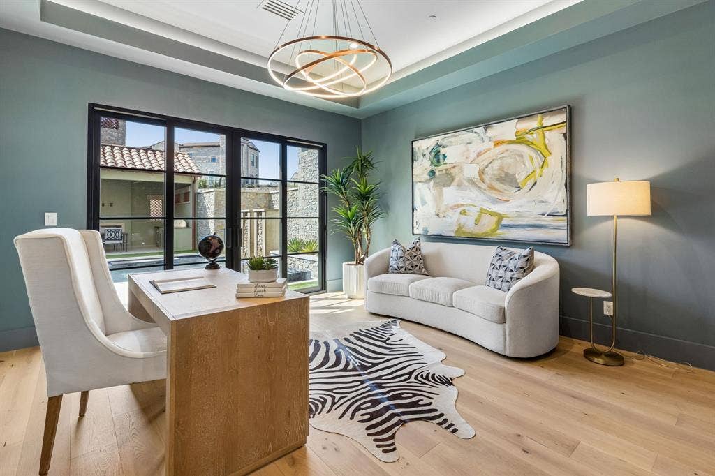 Office or flex room with white oak flooring, sliding iron & glass doors leading to courtyard, Tray ceiling with lighting and designer lighting