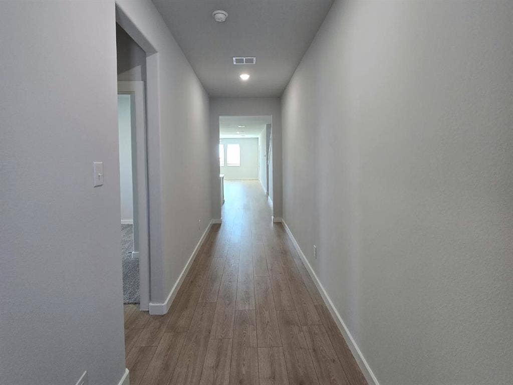 841 Rockcloud Drive, Fort Worth, TX 76052 Hallway with wood-finish flooring, recessed lighting, and neutral wall paint