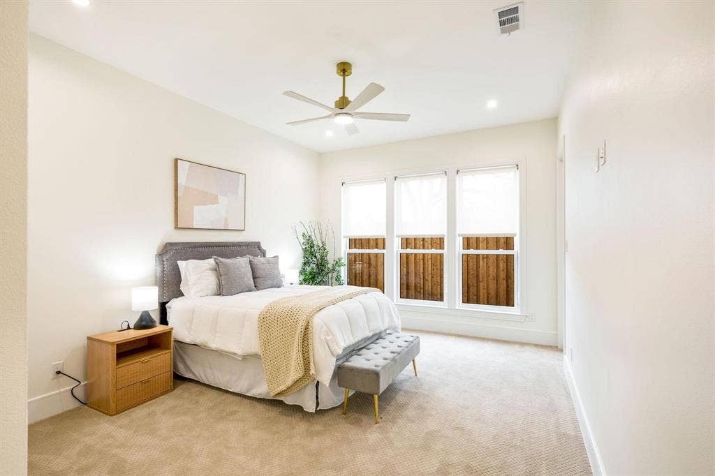 12007 Quincy Lane, Dallas, TX 75230 Recessed lighting, ceiling fan with gold-tone hardware, triple windows with privacy blinds, and light-toned carpeting