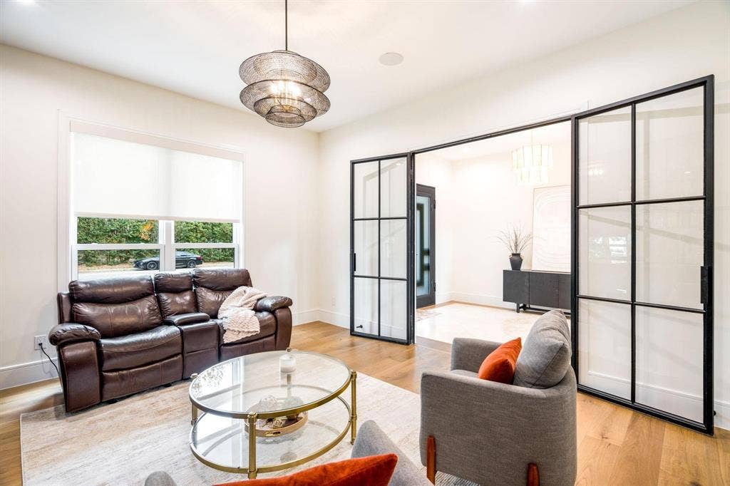 12007 Quincy Lane, Dallas, TX 75230 Hardwood flooring, recessed lighting, and a contemporary chandelier