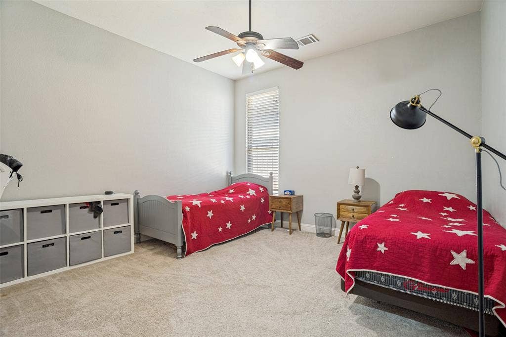 1250 Packsaddle Trail, Prosper, TX 75078 Carpeted room featuring a ceiling fan with integrated lighting and a window with blinds