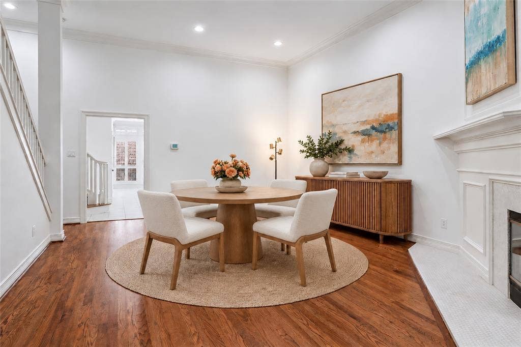 2916 Thomas Avenue, Dallas, TX 75204 Elegant dining room anchored by a round pedestal table and complemented by a circular area rug