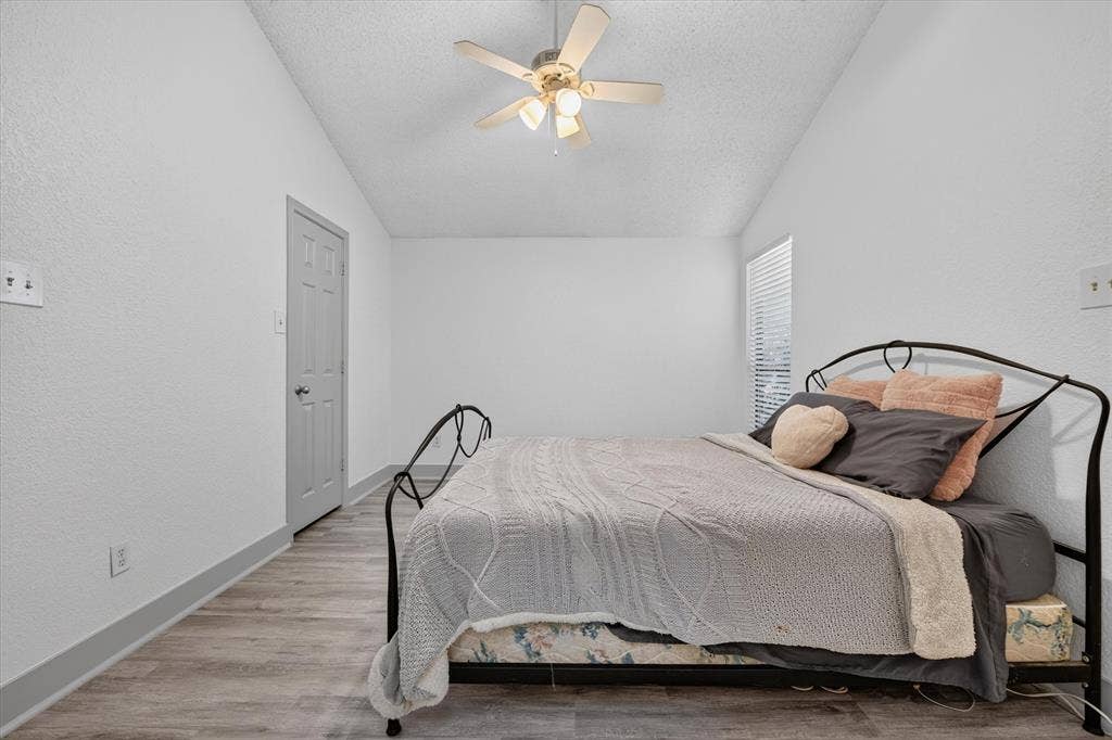 Large primary bedroom with vaulted ceilings make this a great space to call home