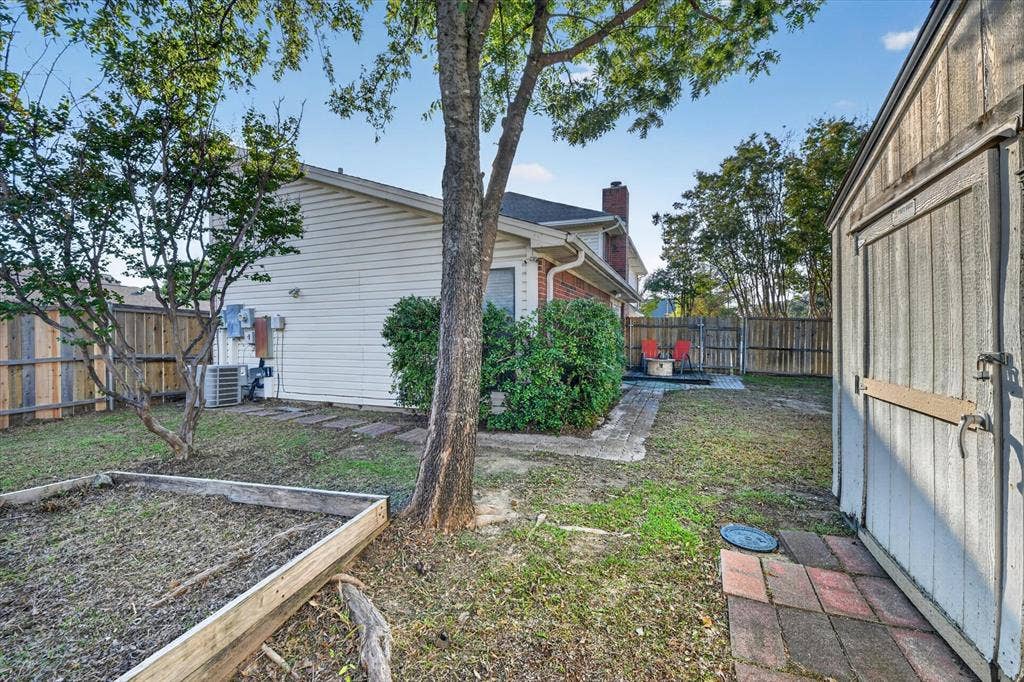 The backyard features a small deck for outdoor enjoyment and a convenient storage shed for tools, equipment, and extra belongings