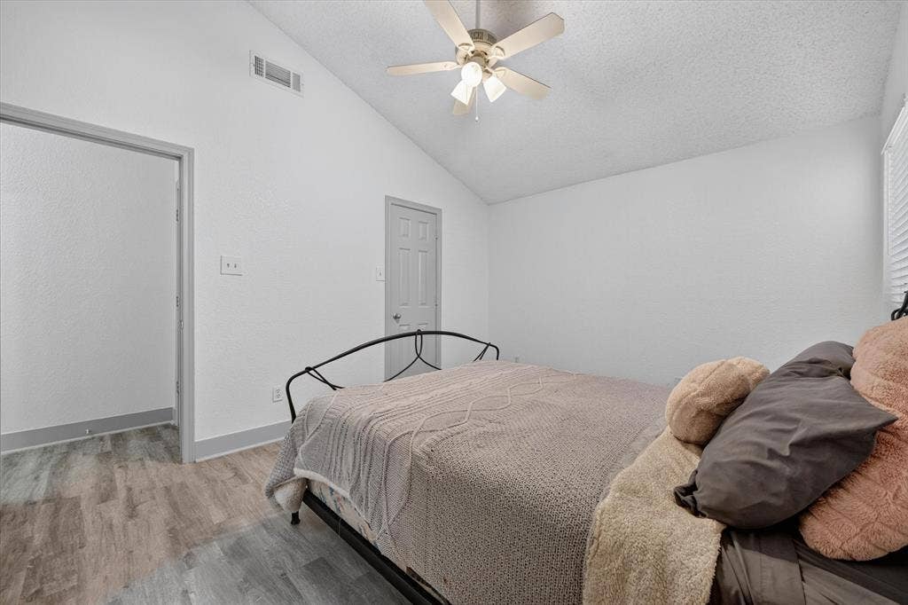 Large primary bedroom with vaulted ceilings and large closet make this a great space to call home