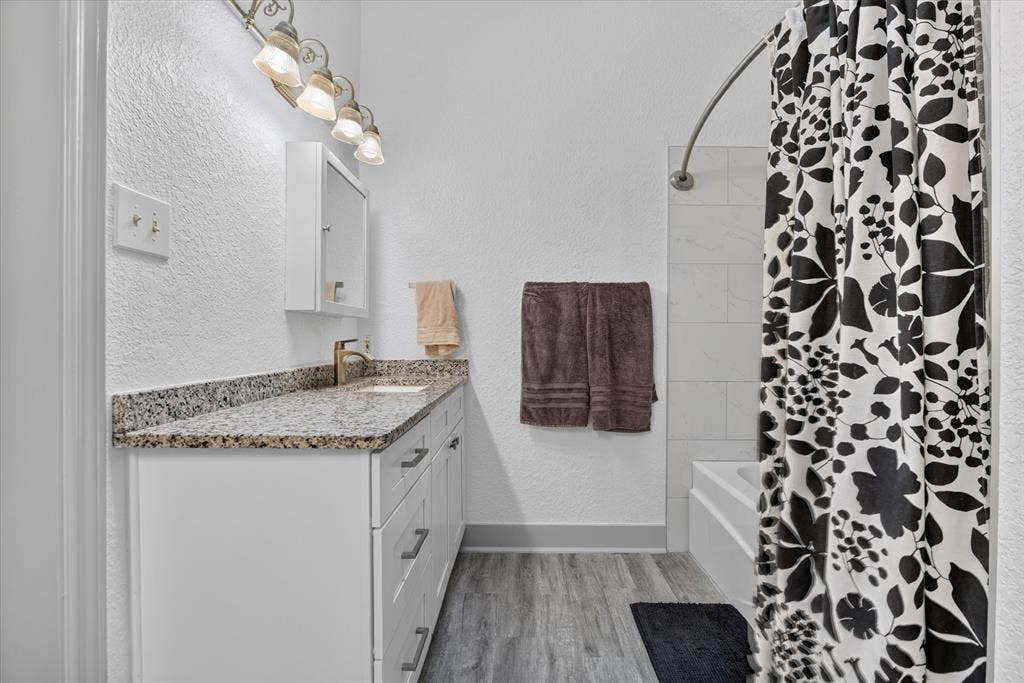 Large primary bathroom with dual vanities
