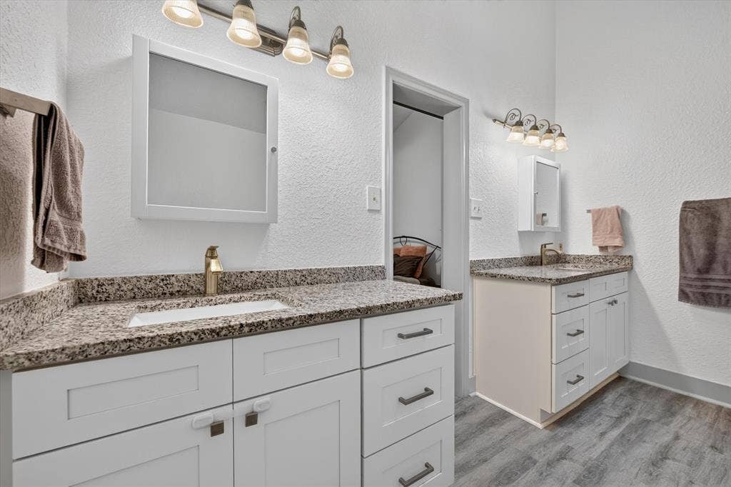 Large primary bathroom with dual vanities