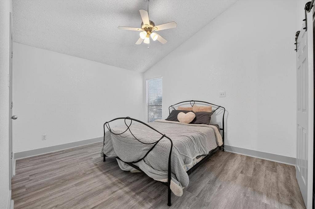 Large primary bedroom with vaulted ceilings make this a great space to call home