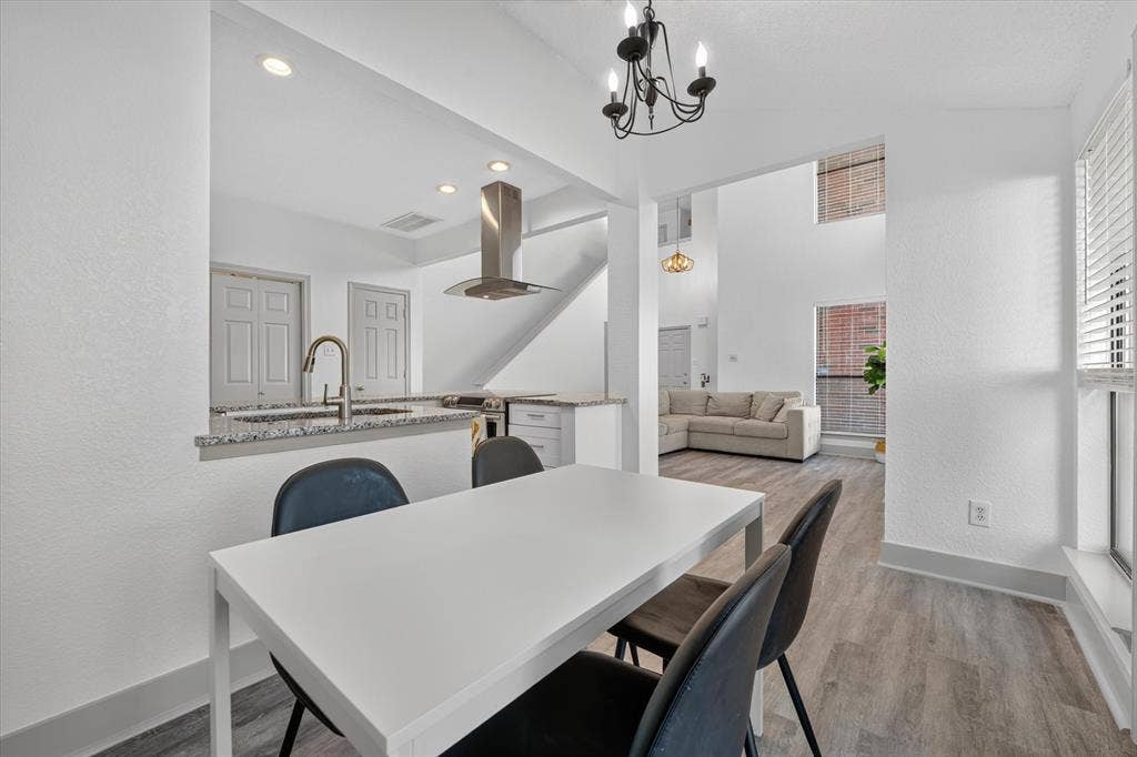 Natural light pours through the windows, brightening the dining area and enhancing its open flow into the kitchen.