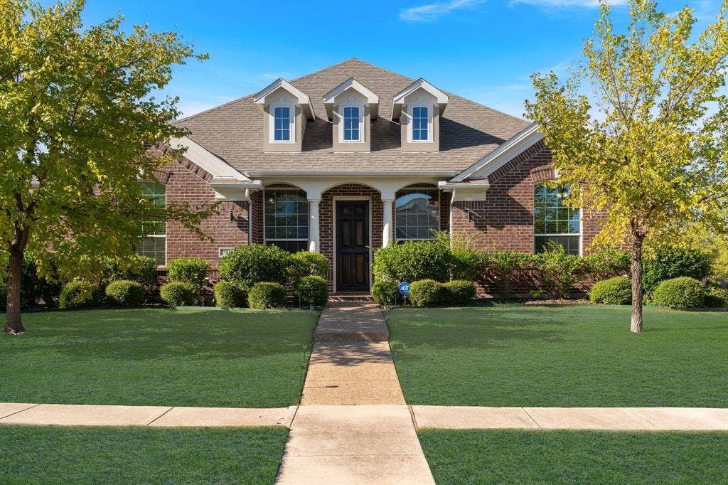 2901 Regents Park Lane, Garland, TX 75043 Enter your new home.Grass color has been enhanced.