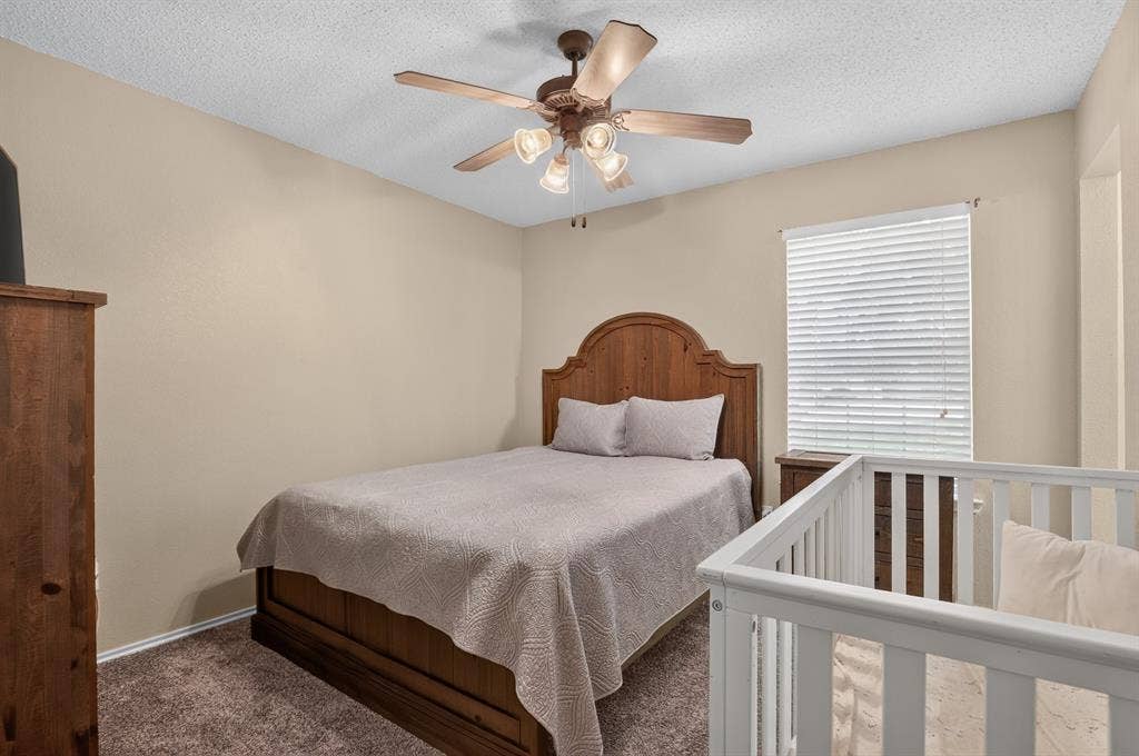 Wall-to-wall carpeting with light beige wall paint