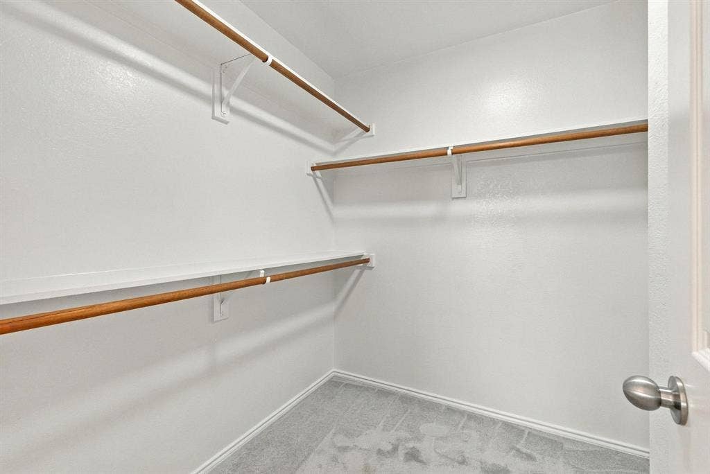 Spacious walk-in closets in the primary bedroom offer plenty of room for clothing and storage.