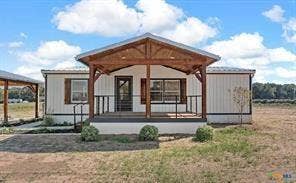 Covered porch with exposed wood beams