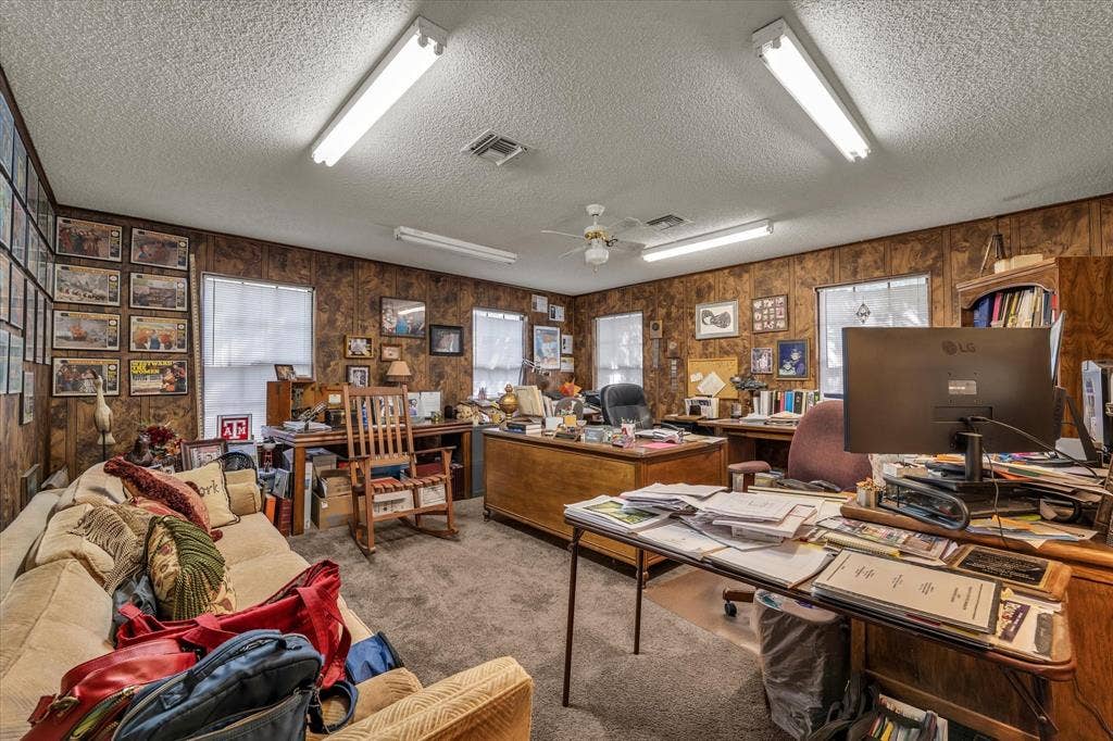 4201 N 19th Street, Waco, TX 76708 Carpeted flooring with multiple windows and wood paneling