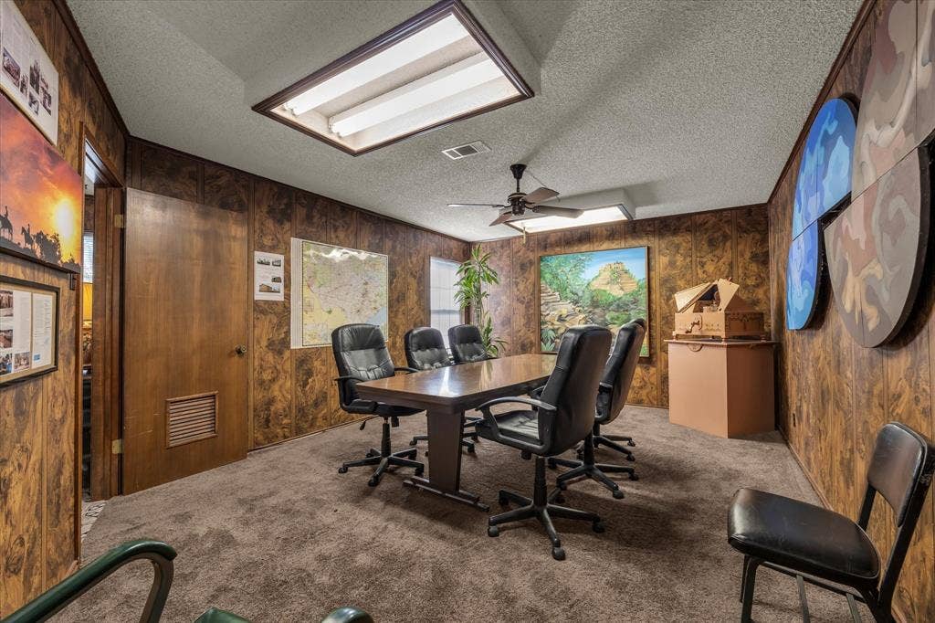 4201 N 19th Street, Waco, TX 76708 Wood-finish paneled walls with a textured ceiling and recessed lighting
