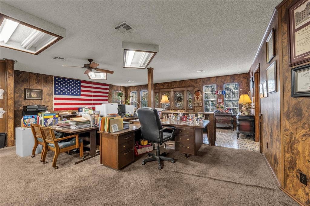 4201 N 19th Street, Waco, TX 76708 Spacious room with carpet flooring, wood paneling, recessed lighting, and a ceiling fan
