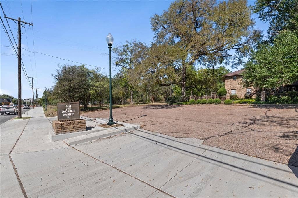 4201 N 19th Street, Waco, TX 76708 Expansive lot featuring a wide sidewalk and a street lamp