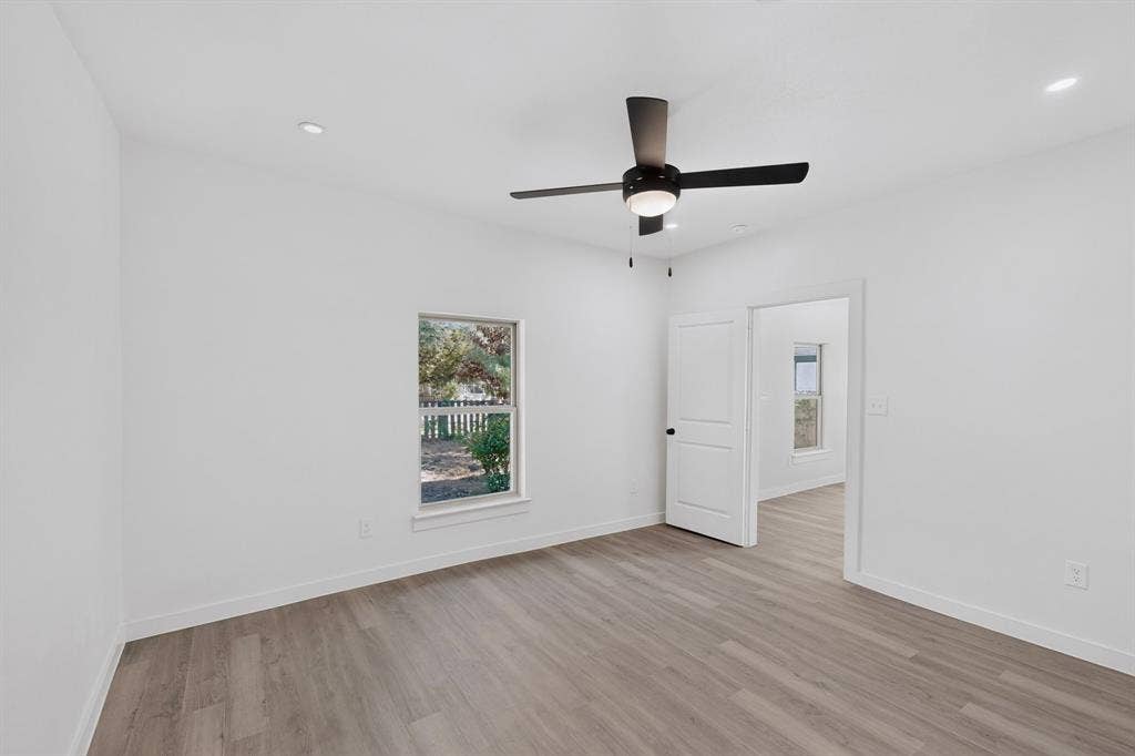 651 Ezekial Avenue, Dallas, TX 75217 Wood-finish flooring, recessed lighting, and a contemporary ceiling fan