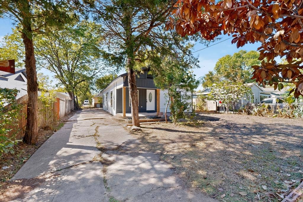 651 Ezekial Avenue, Dallas, TX 75217 Side-gabled home with white siding and a dark gray accent facade