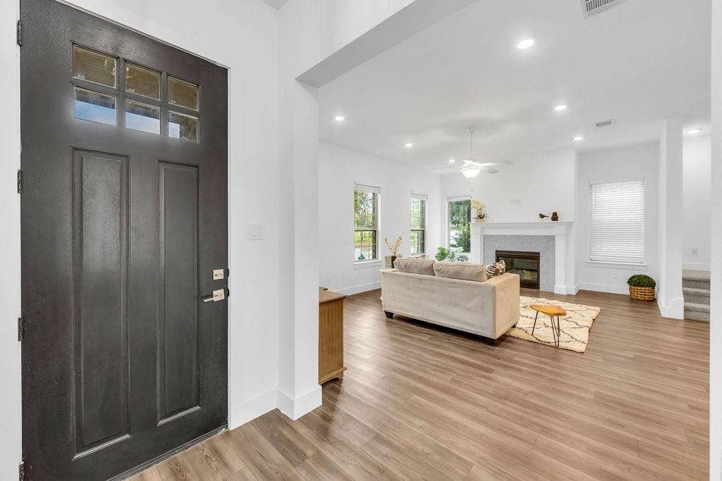 8300 Bethpage Drive, McKinney, TX 75070 Entry door with multi-pane window, wood-finish flooring, recessed lighting, and white trim
