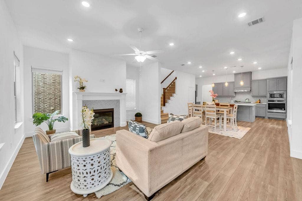8300 Bethpage Drive, McKinney, TX 75070 Open-concept living area with wood-finish flooring, recessed lighting, and a white ceiling fan