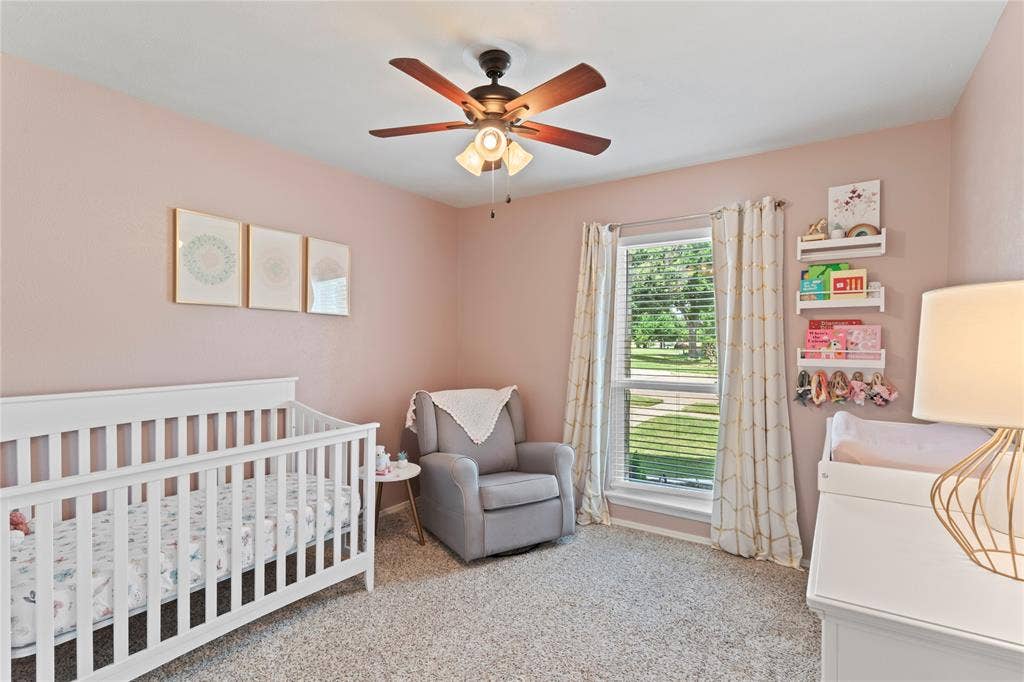 Bedroom 3 with plenty of natural light and ceiling fan.