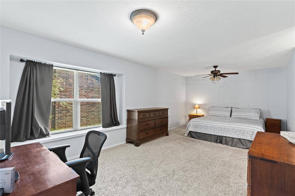 Primary bedroom has room for sitting area or desk