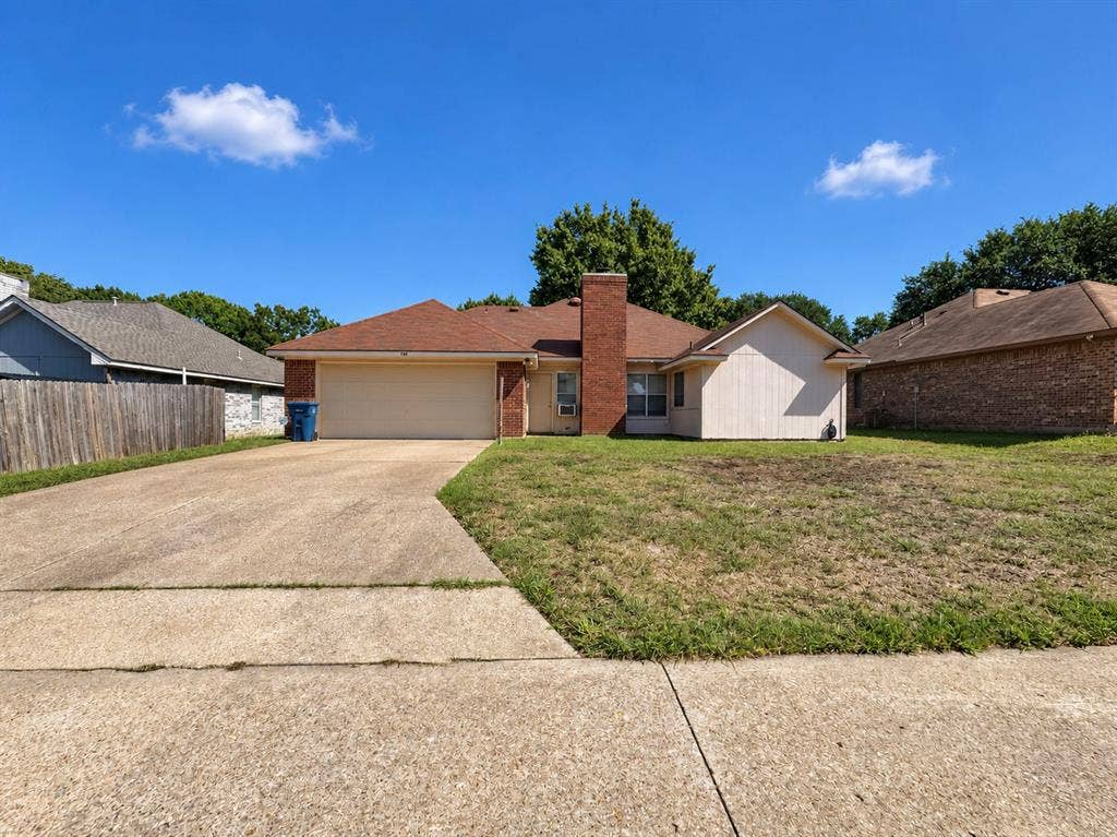 725 Andalusia Trail, DeSoto, TX 75115 Single-story residence featuring a brick and siding exterior, an attached two-car garage, and a concrete driveway