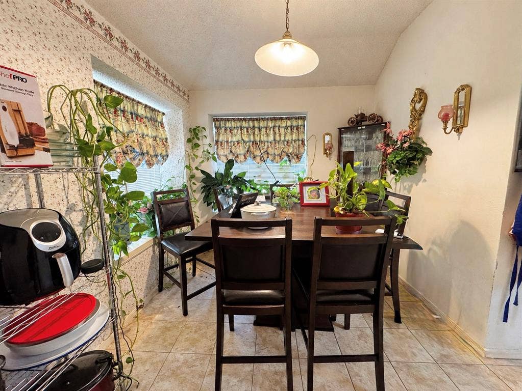 725 Andalusia Trail, DeSoto, TX 75115 Tile flooring, vaulted ceiling, and recessed windows with valances