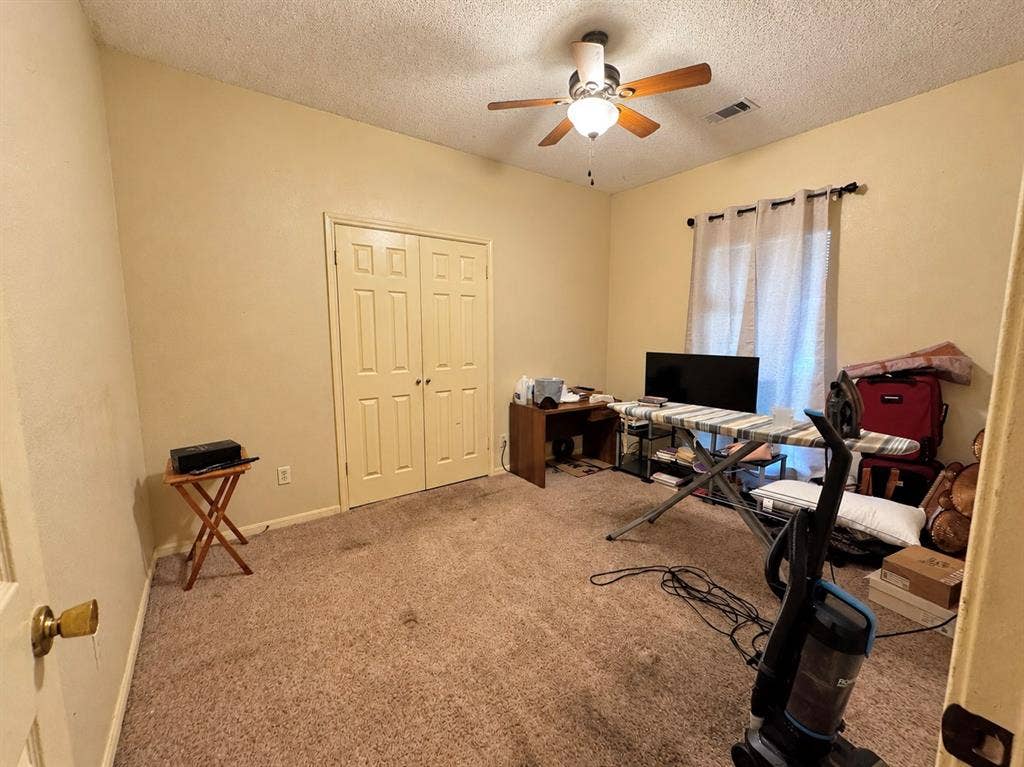725 Andalusia Trail, DeSoto, TX 75115 Recessed lighting with a ceiling fan, dual panel closet doors, and a window with curtain rods