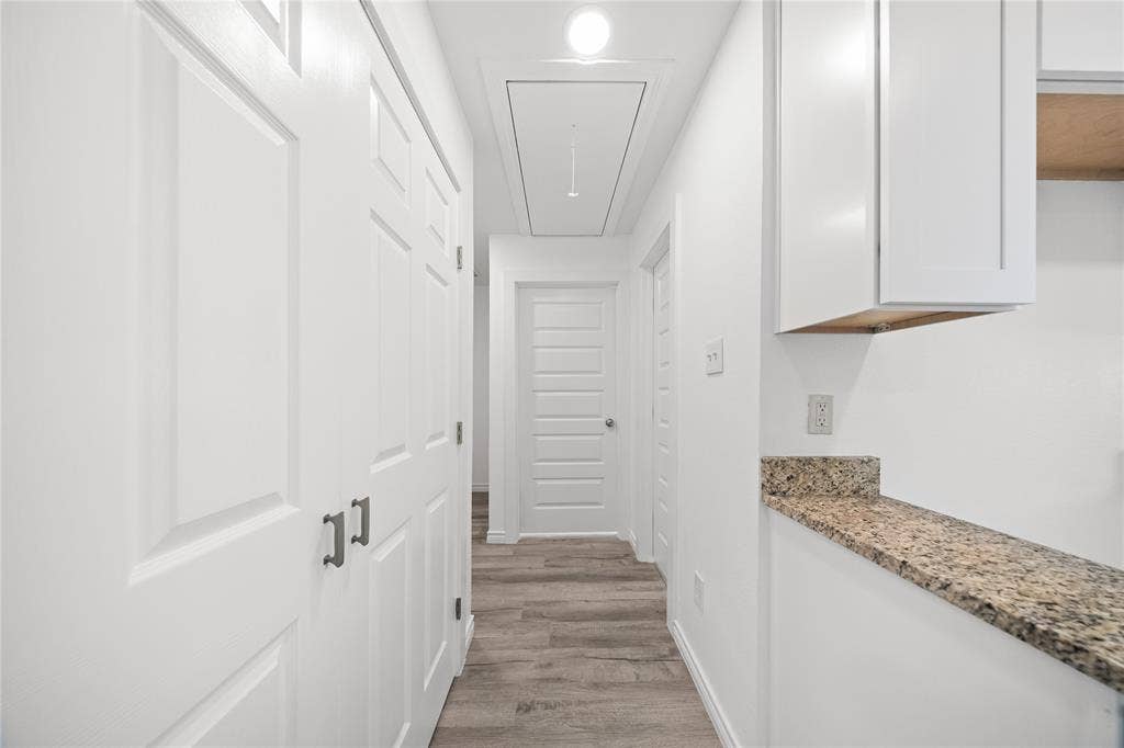 12924 Mitchell Drive, Balch Springs, TX 75180 hallway to 3 bedrooms, full bath, and laundry