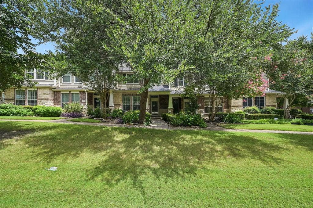 2209 Stonepark Place, McKinney, TX 75071 Stone and siding exterior with mature trees and landscaped planting beds