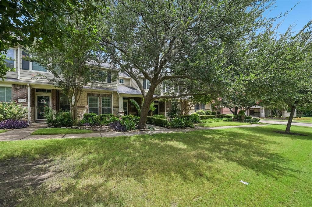 2209 Stonepark Place, McKinney, TX 75071 Two-story facade with stone and siding accents, featuring a covered entry and multiple window exposures