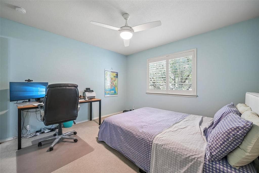 2209 Stonepark Place, McKinney, TX 75071 Recessed lighting, ceiling fan, window with plantation shutters, light blue wall paint, and neutral carpeting