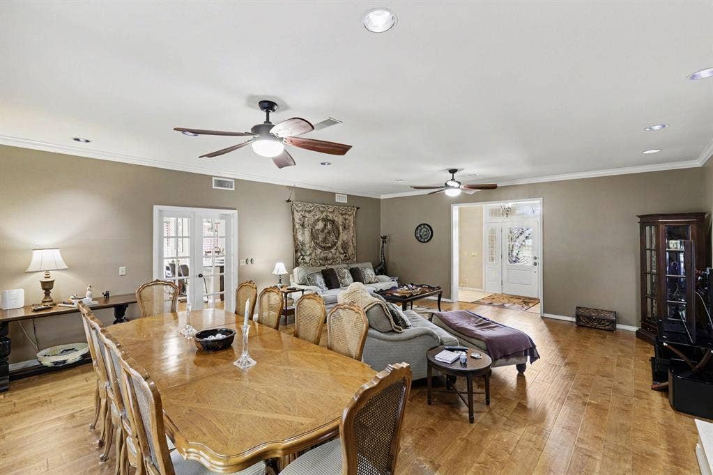 26 Brookhaven Drive, Lucas, TX 75002 Wood-finish flooring, recessed lighting, crown molding, and multiple ceiling fans
