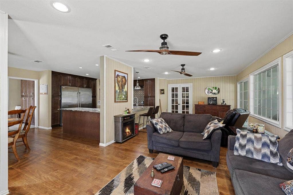 26 Brookhaven Drive, Lucas, TX 75002 Wood-finish flooring throughout, recessed ceiling lighting, and multiple windows providing ample natural light