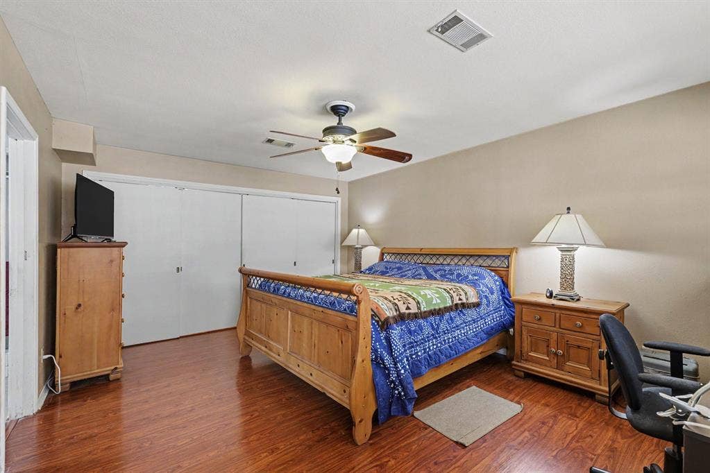 26 Brookhaven Drive, Lucas, TX 75002 Wood-finish flooring throughout, ceiling fan with integrated lighting, and multiple sliding closet doors