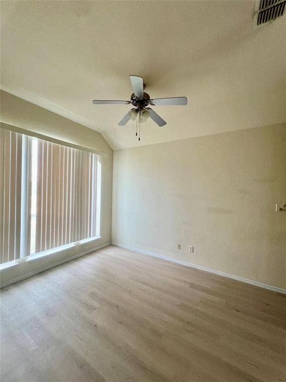 1801 Kathryn Court, Arlington, TX 76018 Wood-finish flooring, vaulted ceiling, ceiling fan with integrated lighting, window with vertical blinds