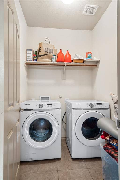 1620 Secretariat Lane, Irving, TX 75060 Laundry room downstairs with full size washer and dryer
