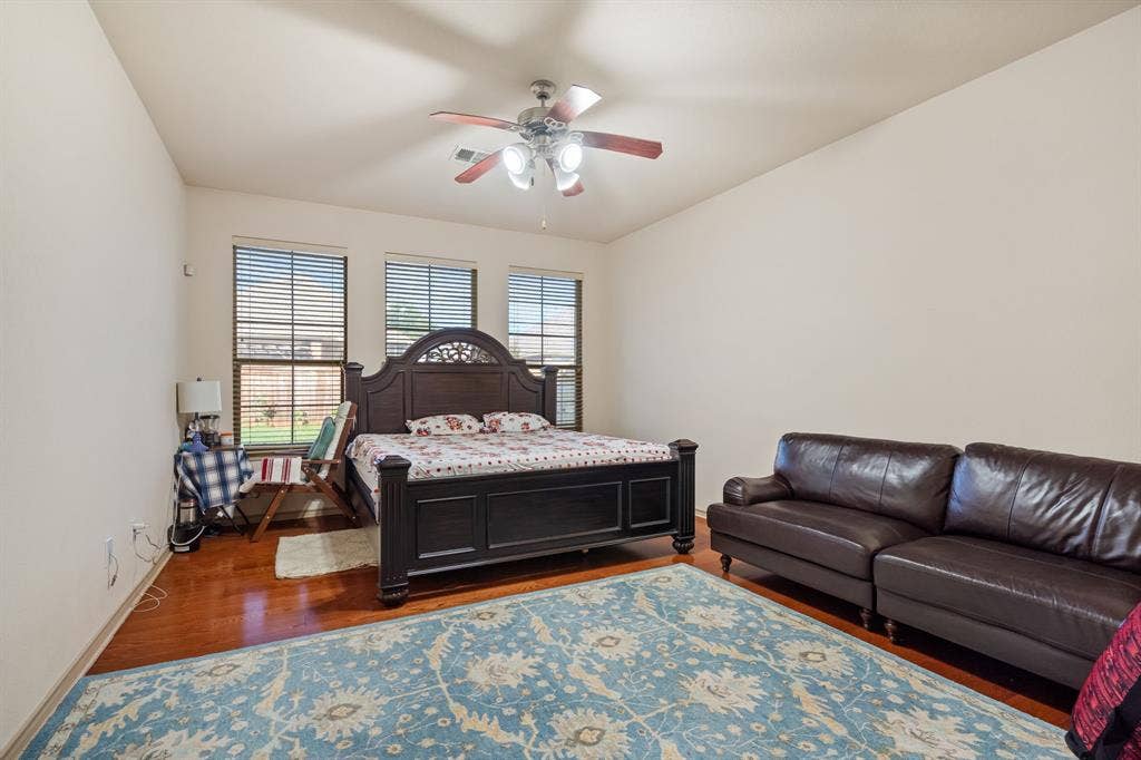 1620 Secretariat Lane, Irving, TX 75060 Primary Bedroom with lots of natural light and ceiling fan