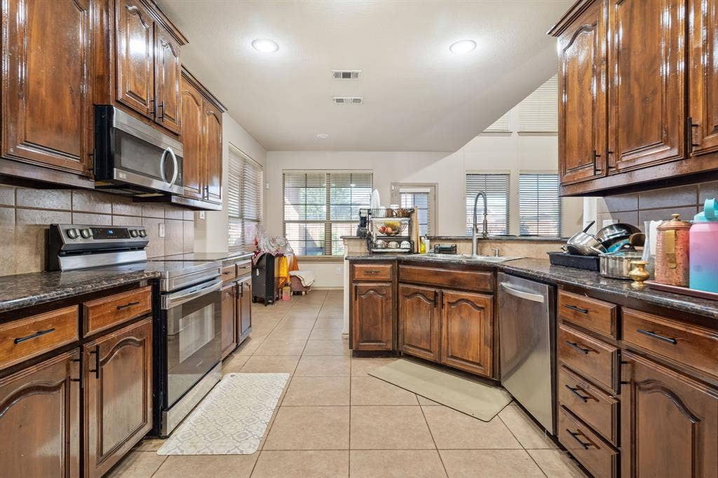 1620 Secretariat Lane, Irving, TX 75060 View of Kitchen, Breakfast Bar and Breakfast Nook from the Dining Room