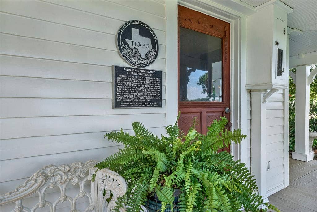 1425-1 Lone Star Road, Celina, TX 75009 A designated Texas Historic Landmark, the John Elias and Ida May Herrington House is recognized for its historical significance and enduring craftsmanship. The official historical marker highlights the home's rich heritage, while the welcoming front porch and original entry door offer a glimpse into the property's timeless character and well-preserved architectural details.