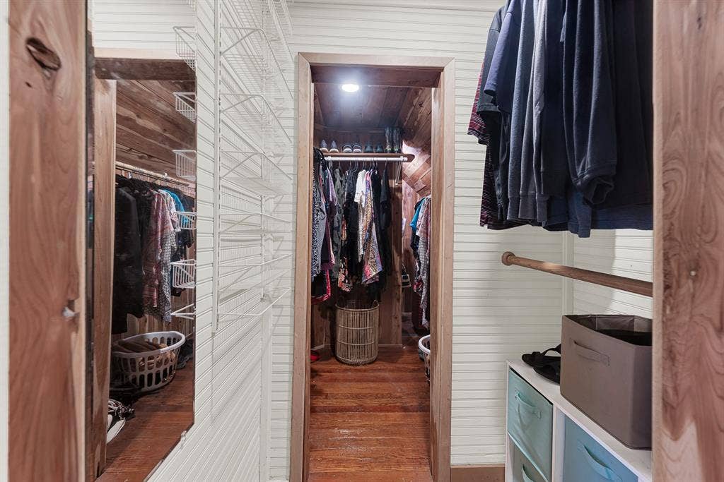 1425-1 Lone Star Road, Celina, TX 75009 The spacious cedar-lined walk-through closet is a rare feature for a home of this era, offering generous storage while preserving its timeless character. Start each day with everything neatly organized and enjoy a dressing space that's as functional as it is inviting.