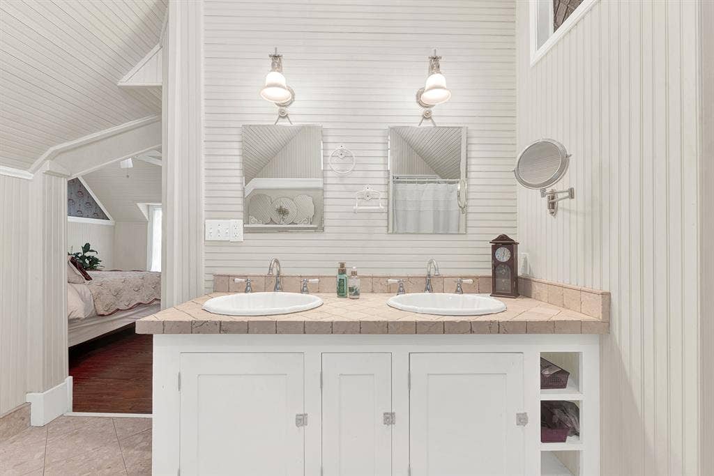 1425-1 Lone Star Road, Celina, TX 75009 Dual vanities framed by crisp beadboard walls offer classic styling with the convenience of a thoughtfully updated design. Mornings flow with ease when everyone has their own space to prepare for the day.