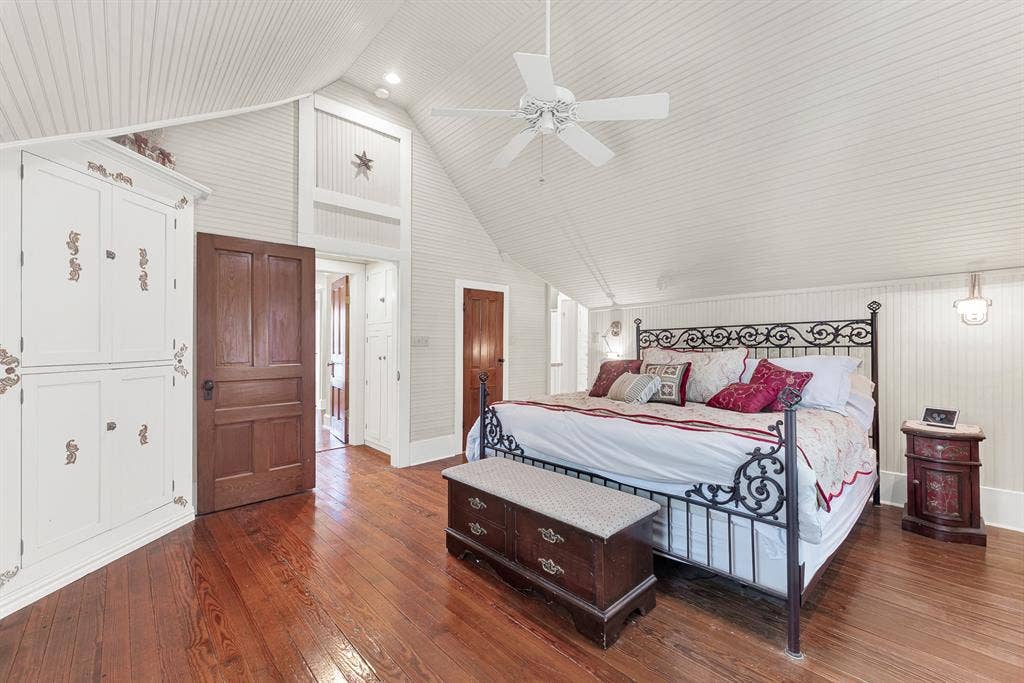 1425-1 Lone Star Road, Celina, TX 75009 Vaulted beadboard ceilings and beautifully restored original hardwood floors create an airy retreat that blends historic character with the comfort of a thoughtfully rebuilt home. Wake to peaceful country views and end each day in a space that feels quiet, bright, and wonderfully relaxing.